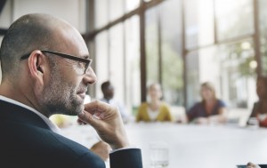 man at desk thinking