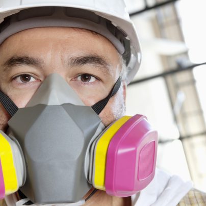 Construction worker in dust mask